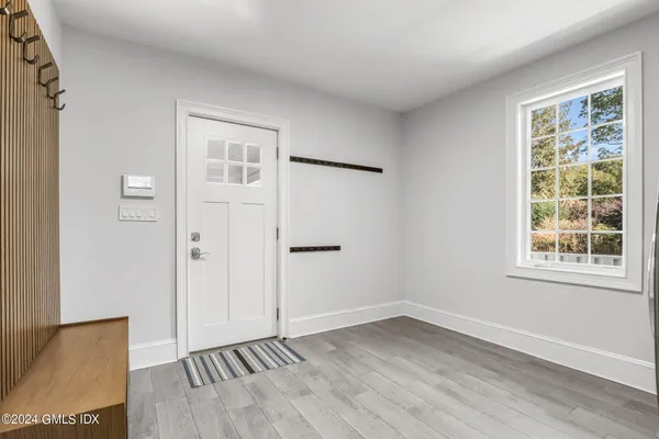 a view of living room with furniture and wooden floor