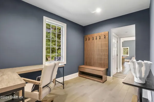 a bathroom with a bathtub a shower a sink and a window