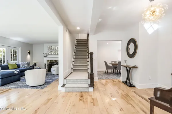 a view of a livingroom with furniture and a wooden floor