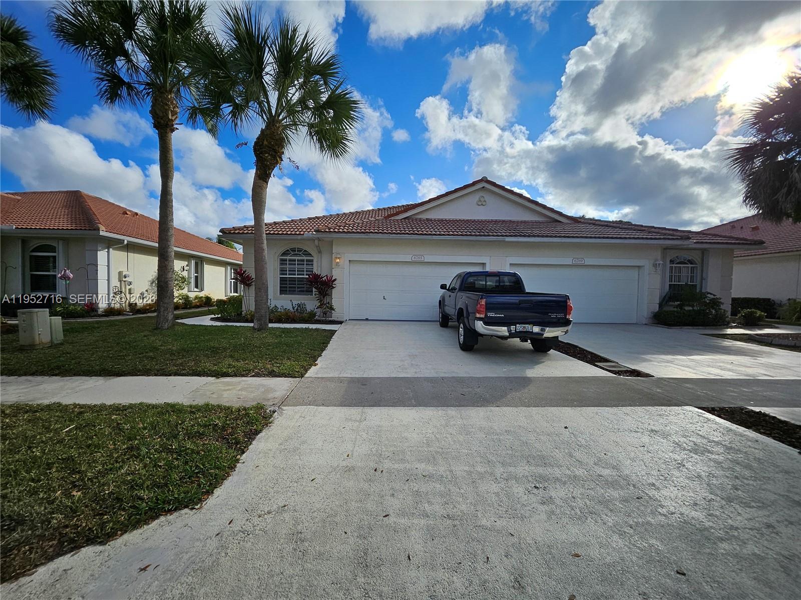 6785 Southeast Warwick Lane Stuart, FL 34997 - Photo 2 of 53 Two car garage barrel roof