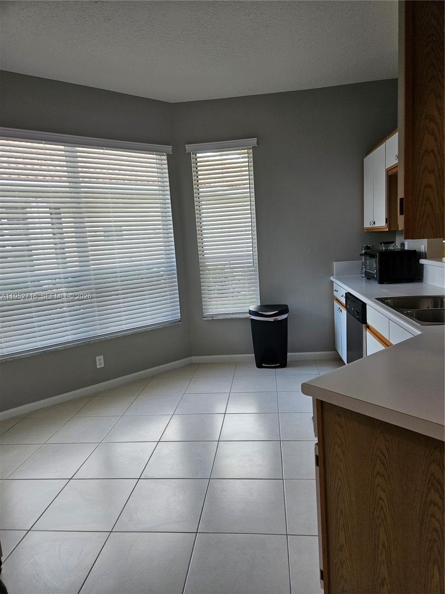 6785 Southeast Warwick Lane Stuart, FL 34997 - Photo 26 of 53 Eat in Kitchen with plenty of natural light