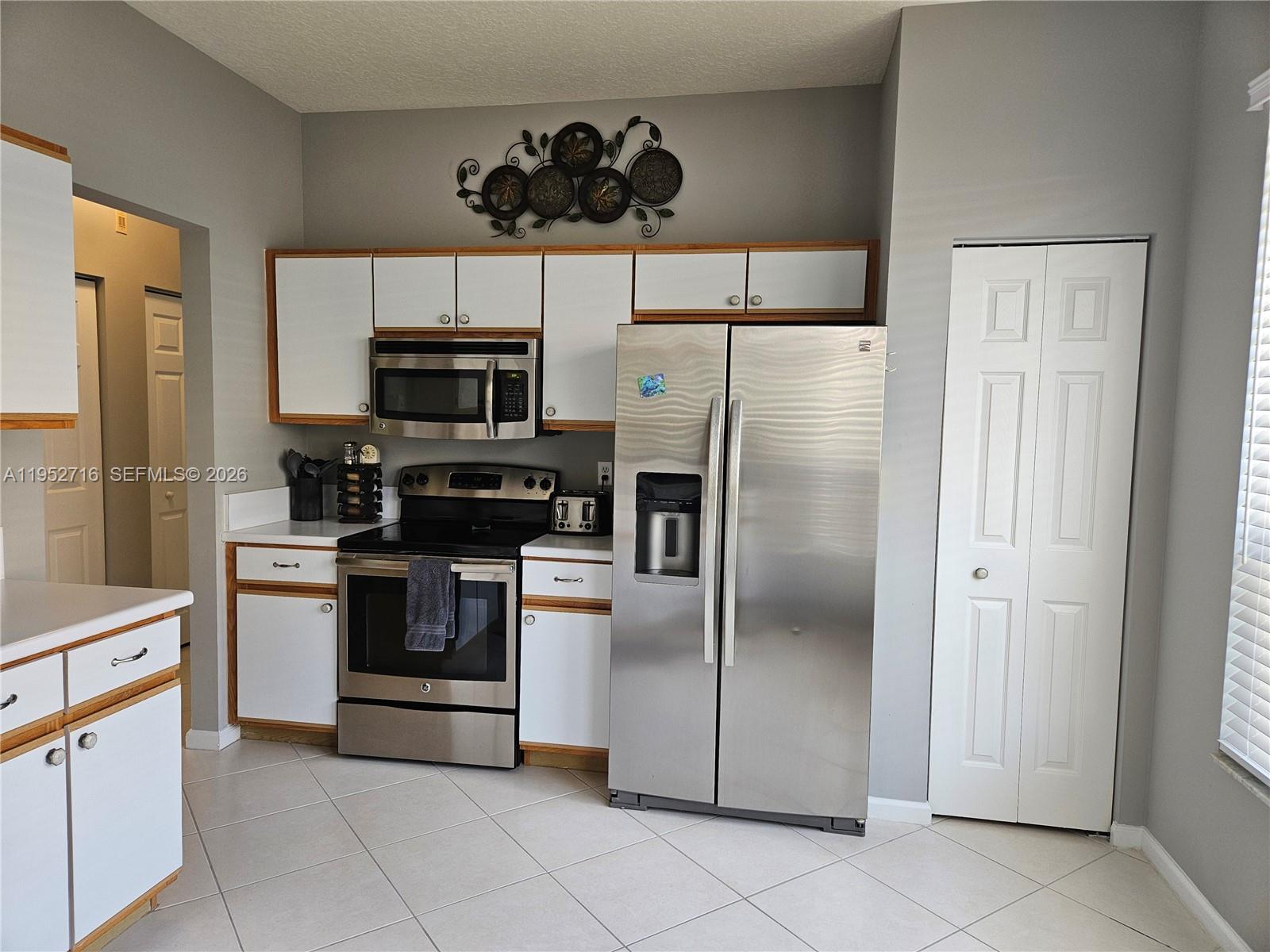 6785 Southeast Warwick Lane Stuart, FL 34997 - Photo 6 of 53 Plenty of cabinets pantry coset