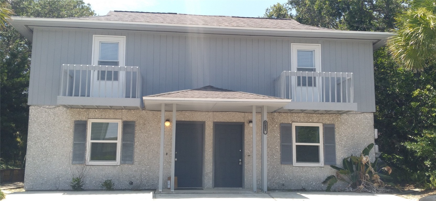 a front view of a house with a garage