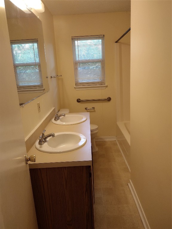 2403 B 1st Avenue Fernandina Beach, FL 32034 - Photo 13 of 17 a bathroom with a sink and a mirror