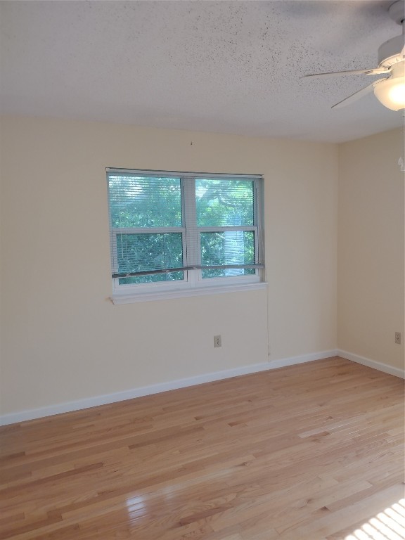 2403 B 1st Avenue Fernandina Beach, FL 32034 - Photo 15 of 17 a view of an empty room with wooden floor and a window