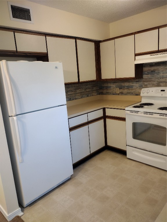 2403 B 1st Avenue Fernandina Beach, FL 32034 - Photo 2 of 17 a kitchen with a sink a refrigerator and a stove