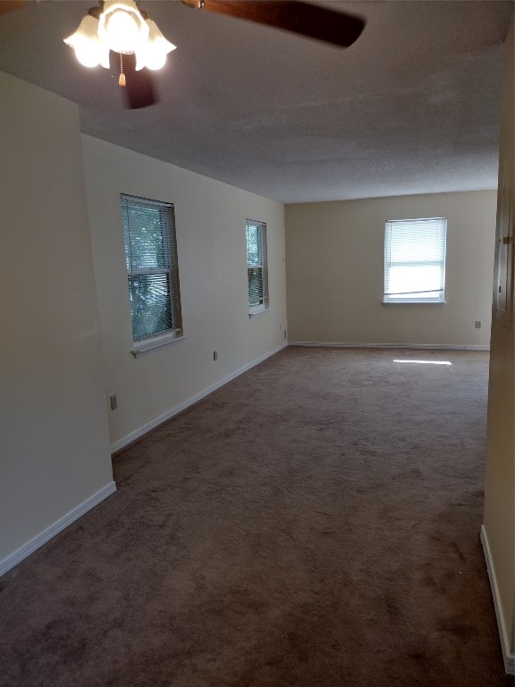 2403 B 1st Avenue Fernandina Beach, FL 32034 - Photo 5 of 17 a view of an empty room with a chandelier fan