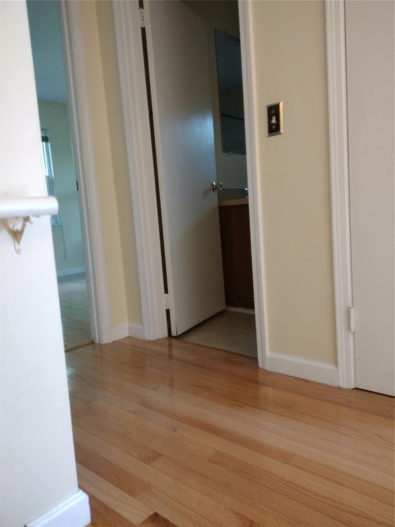 2403 B 1st Avenue Fernandina Beach, FL 32034 - Photo 9 of 17 an empty room with wooden floor and entrance