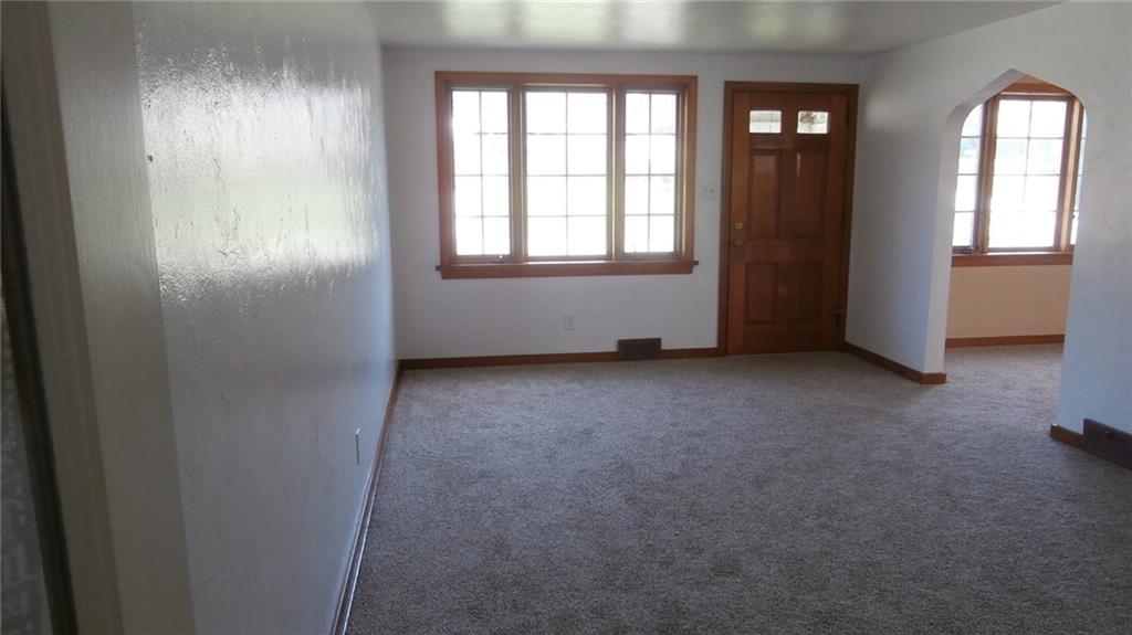 1030 Hastie Road Pittsburgh, PA 15234 - Photo 3 of 19 Light and bright living room freshly painted and new carpeting leads to first floor master bedroom