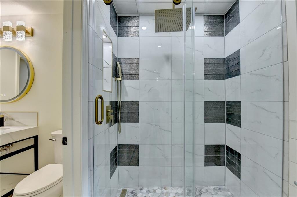 2181 Juanita Street Decatur, GA 30032 - Photo 11 of 15 a bathroom with a toilet sink and shower