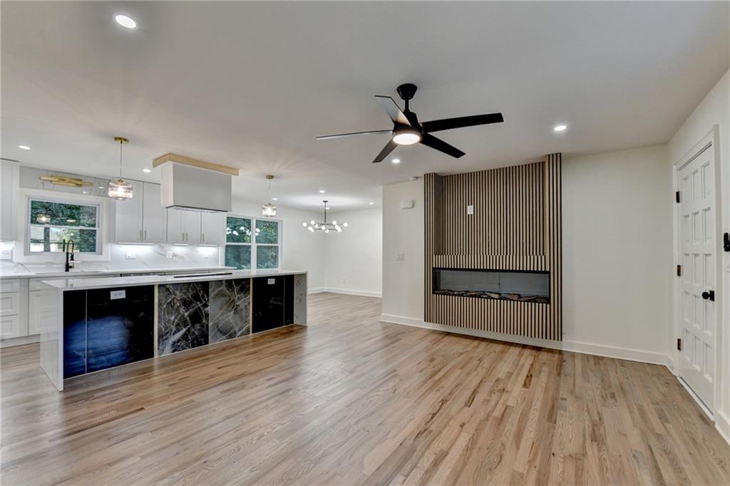 2181 Juanita Street Decatur, GA 30032 - Photo 2 of 15 a large kitchen with stainless steel appliances a large counter top a stove and a wooden floors