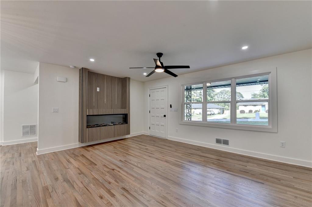 2181 Juanita Street Decatur, GA 30032 - Photo 3 of 15 a view of empty room with wooden floor and fan