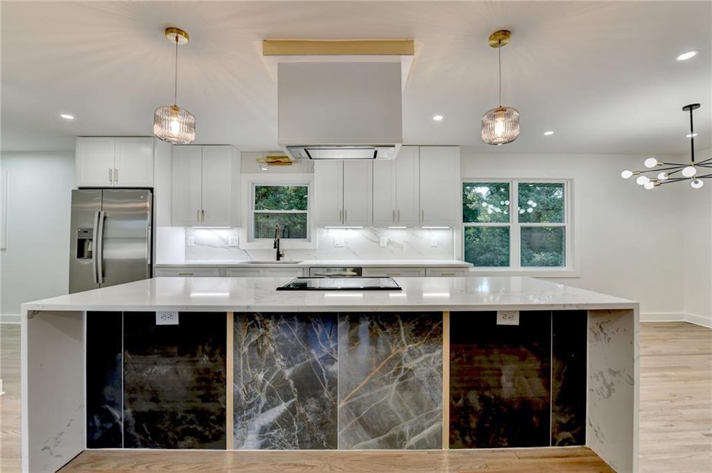 2181 Juanita Street Decatur, GA 30032 - Photo 6 of 15 a kitchen with granite countertop a sink a counter space appliances and cabinets