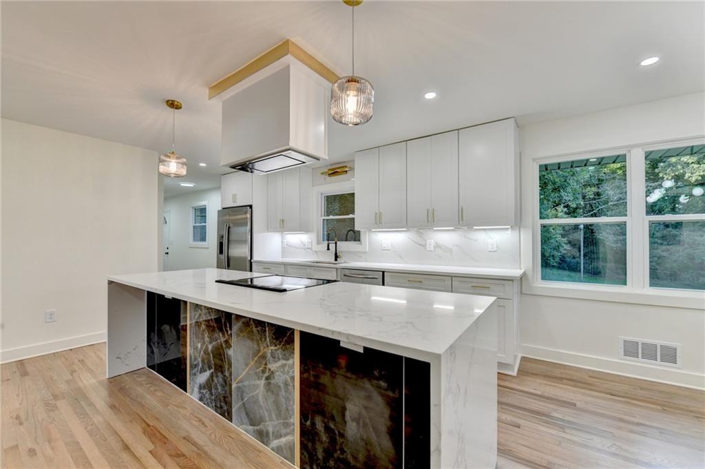 2181 Juanita Street Decatur, GA 30032 - Photo 7 of 15 a kitchen with a sink a counter space appliances and cabinets