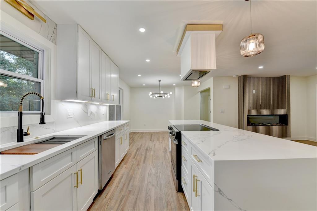 2181 Juanita Street Decatur, GA 30032 - Photo 9 of 15 a kitchen with stainless steel appliances granite countertop a sink and a stove