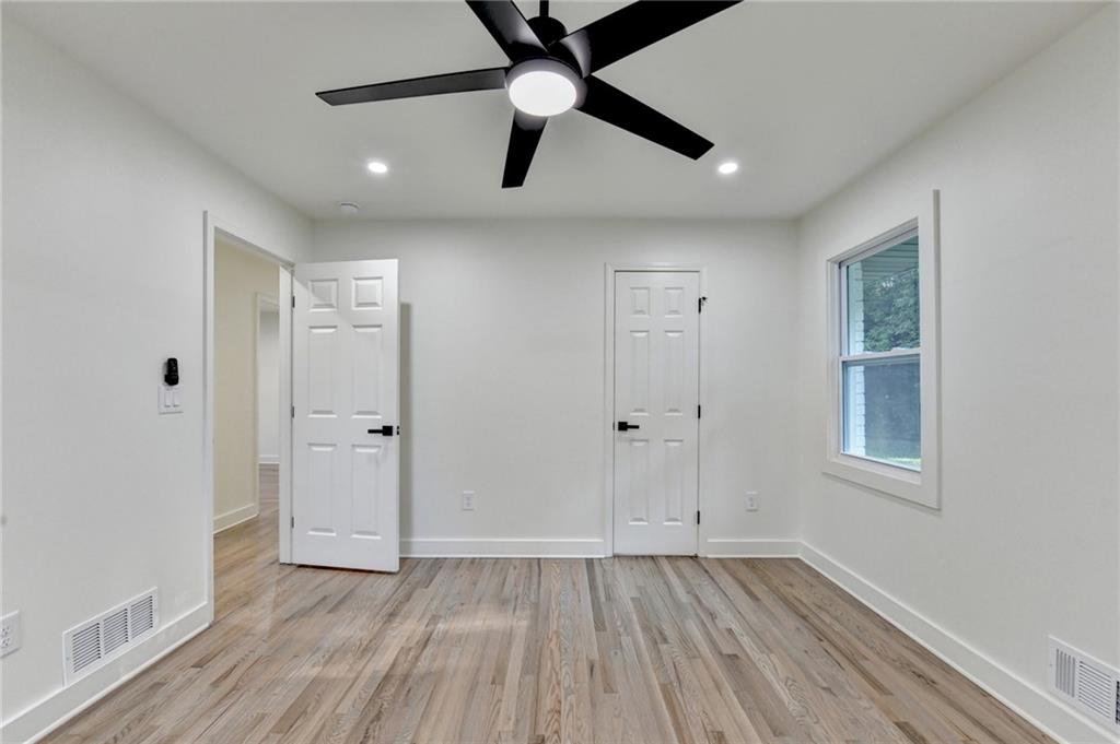 2181 Juanita Street Decatur, GA 30032 - Photo 10 of 15 wooden floor in an empty room with a window