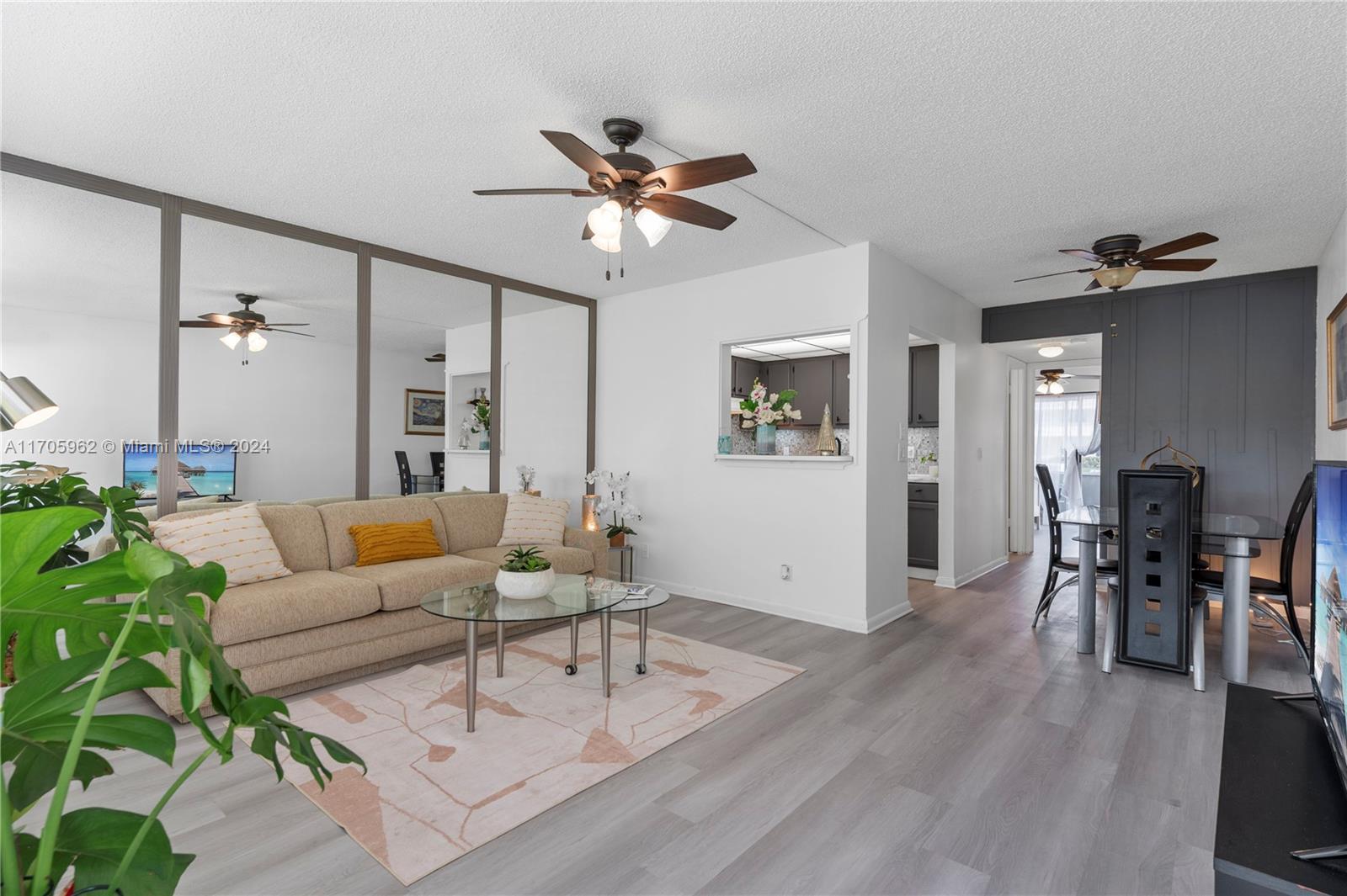 382 Markham R, Unit 382 Deerfield Beach, FL 33442 - Photo 13 of 30 a living room with furniture and wooden floor