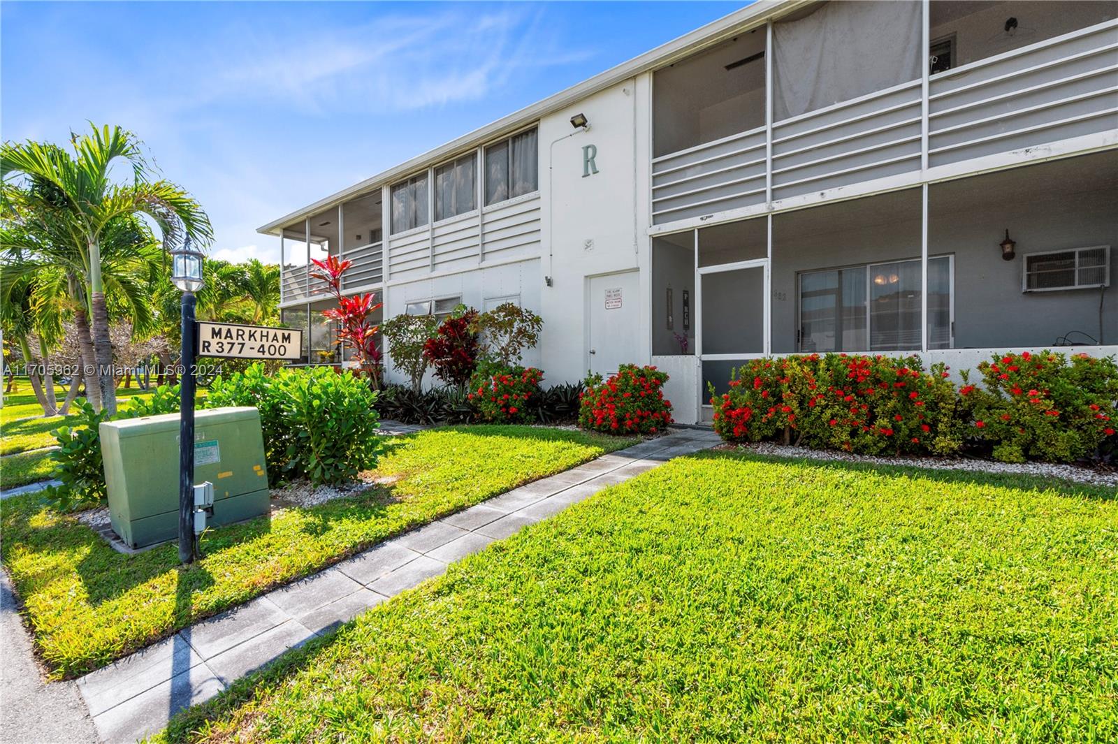 382 Markham R, Unit 382 Deerfield Beach, FL 33442 - Photo 16 of 30 a front view of a house with garden