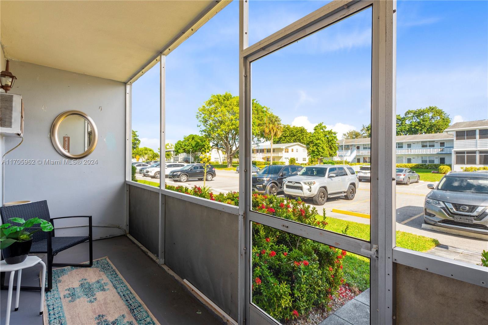 382 Markham R, Unit 382 Deerfield Beach, FL 33442 - Photo 18 of 30 a view of a porch with furniture