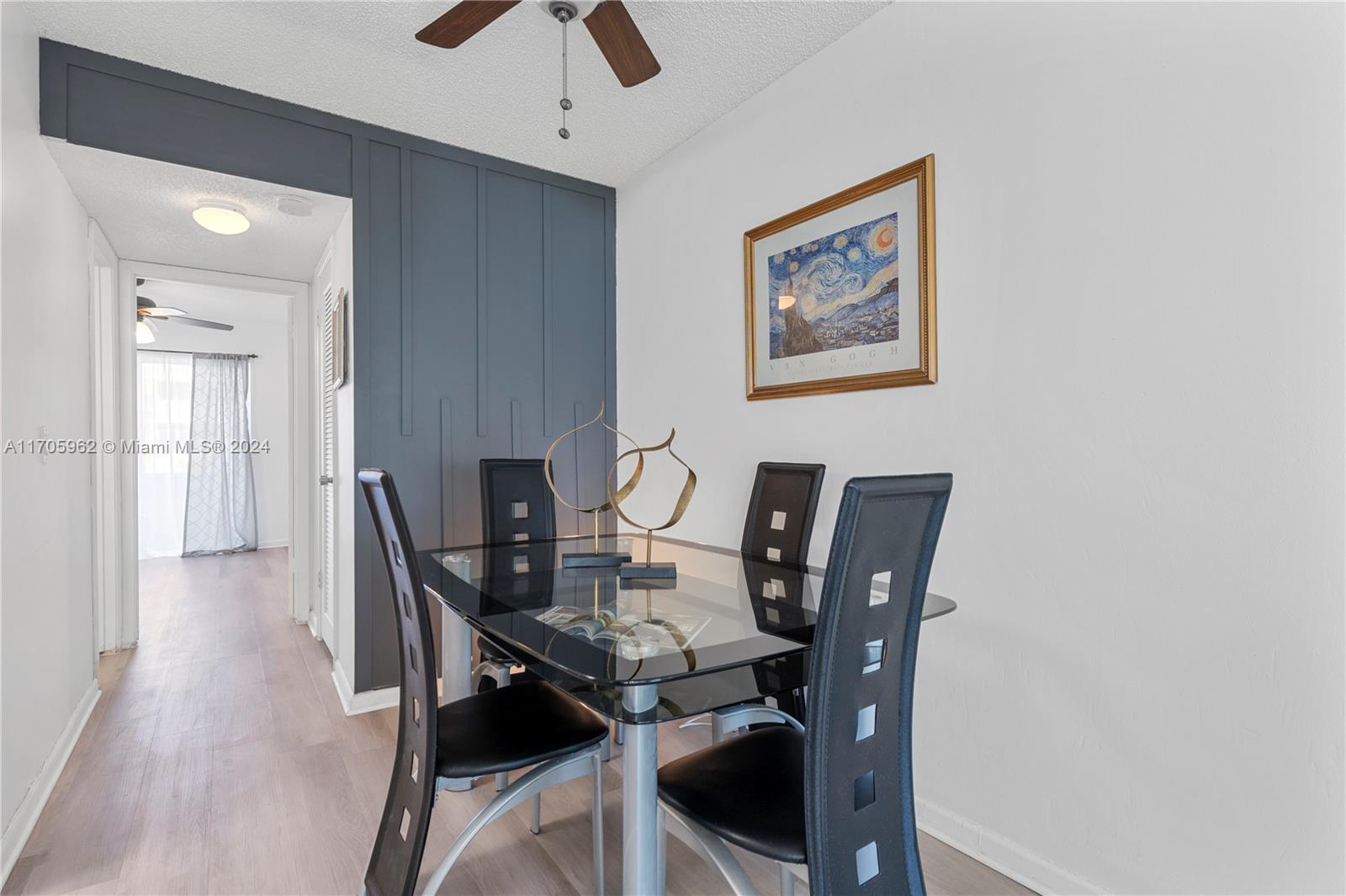 382 Markham R, Unit 382 Deerfield Beach, FL 33442 - Photo 7 of 30 a view of a dining room with furniture and wooden floor