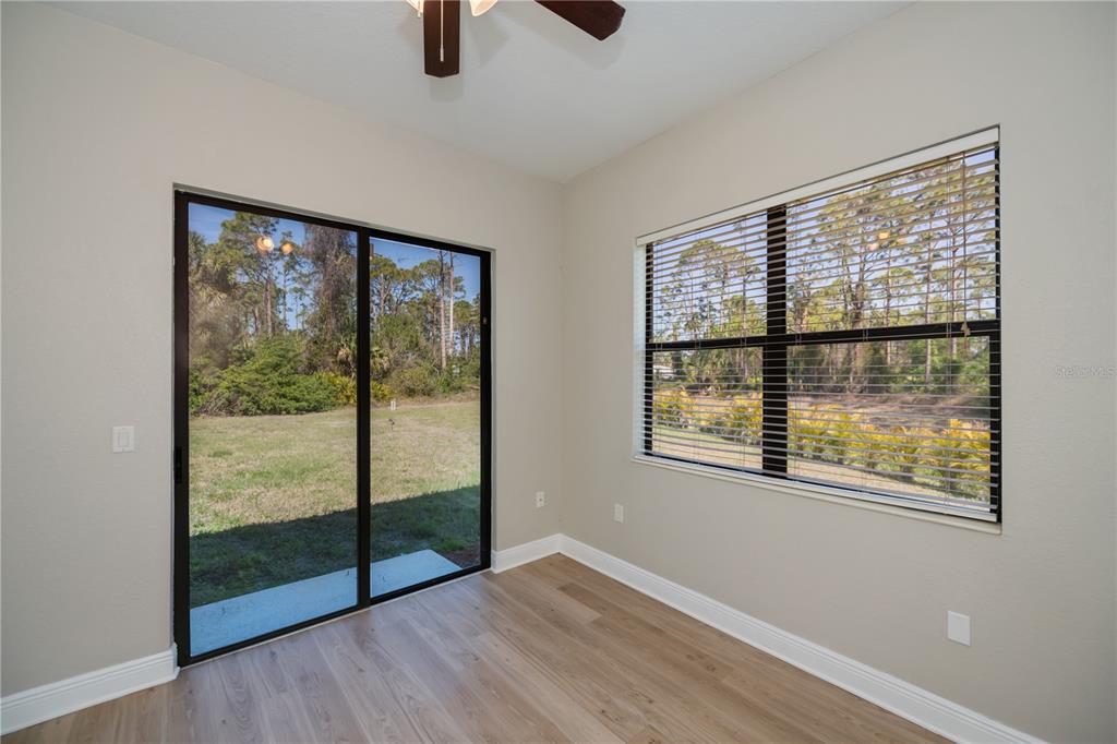 3284 Newmark Street North Port, FL 34291 - Photo 35 of 44 wooden floor in an empty room with a window