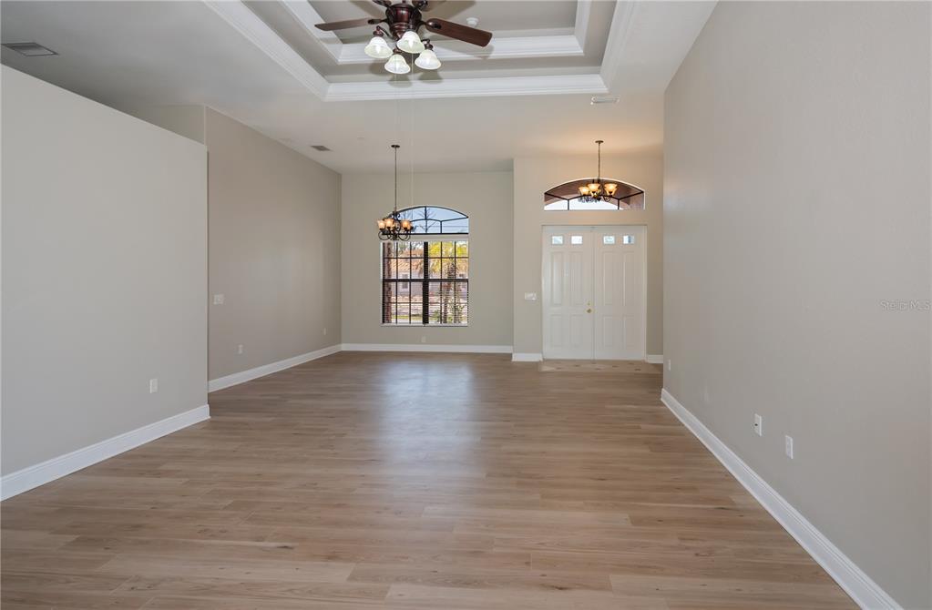 3284 Newmark Street North Port, FL 34291 - Photo 5 of 44 wooden floor in an empty room with a window