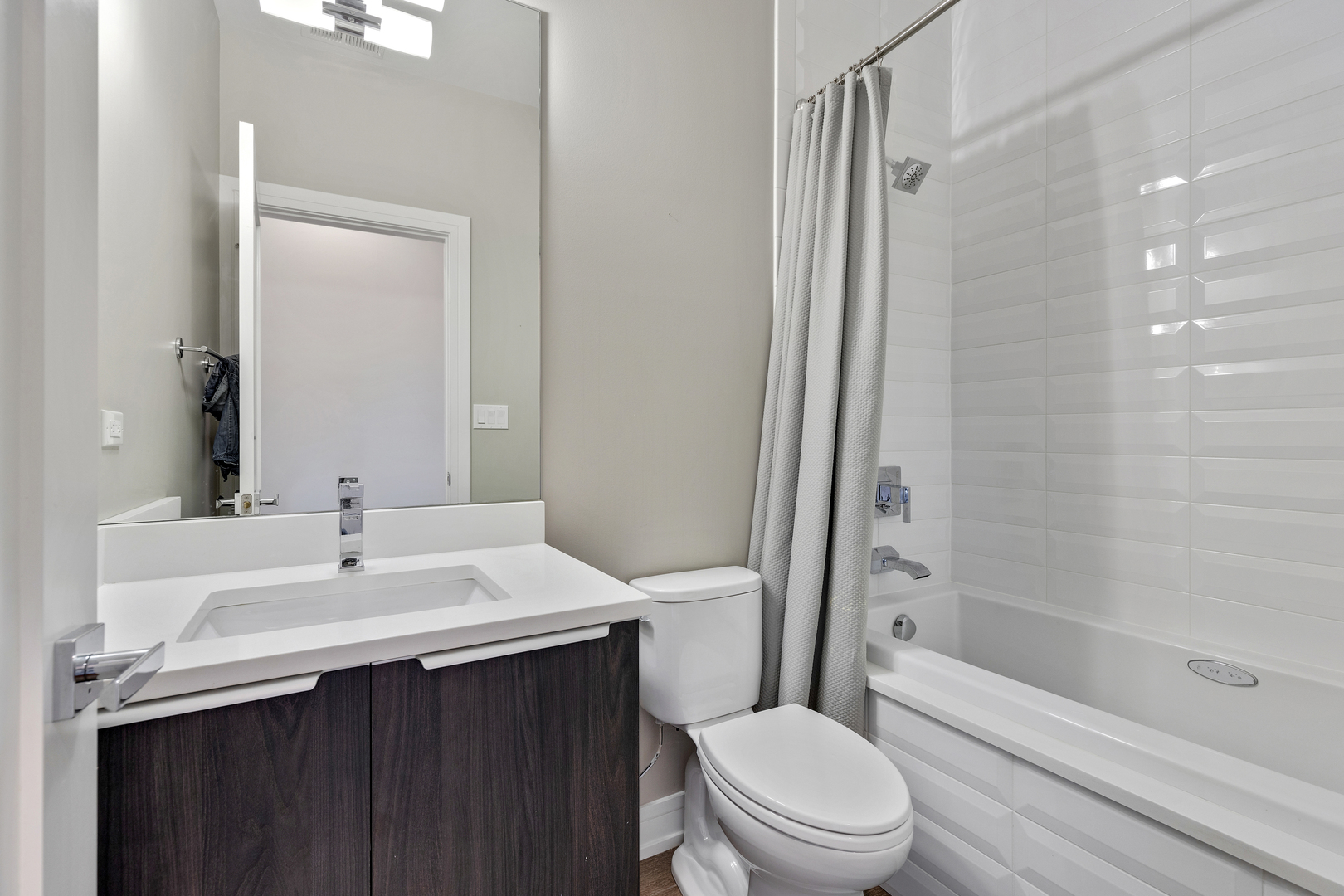 1820 West Haddon Avenue, Unit 2 Chicago, IL 60622 - Photo 12 of 18 a bathroom with a sink toilet and shower