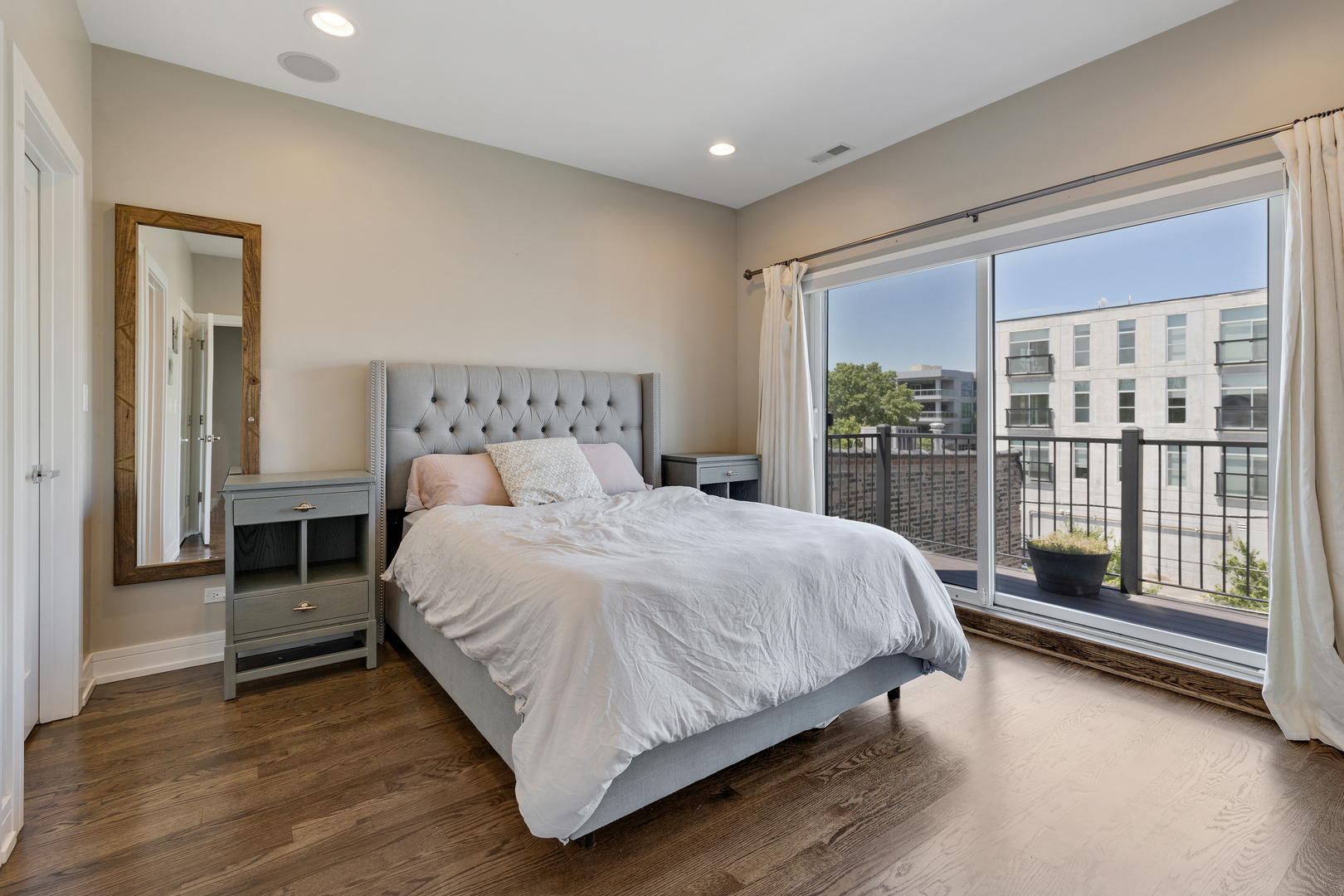 1820 West Haddon Avenue, Unit 2 Chicago, IL 60622 - Photo 13 of 18 a bedroom with a bed and a large window