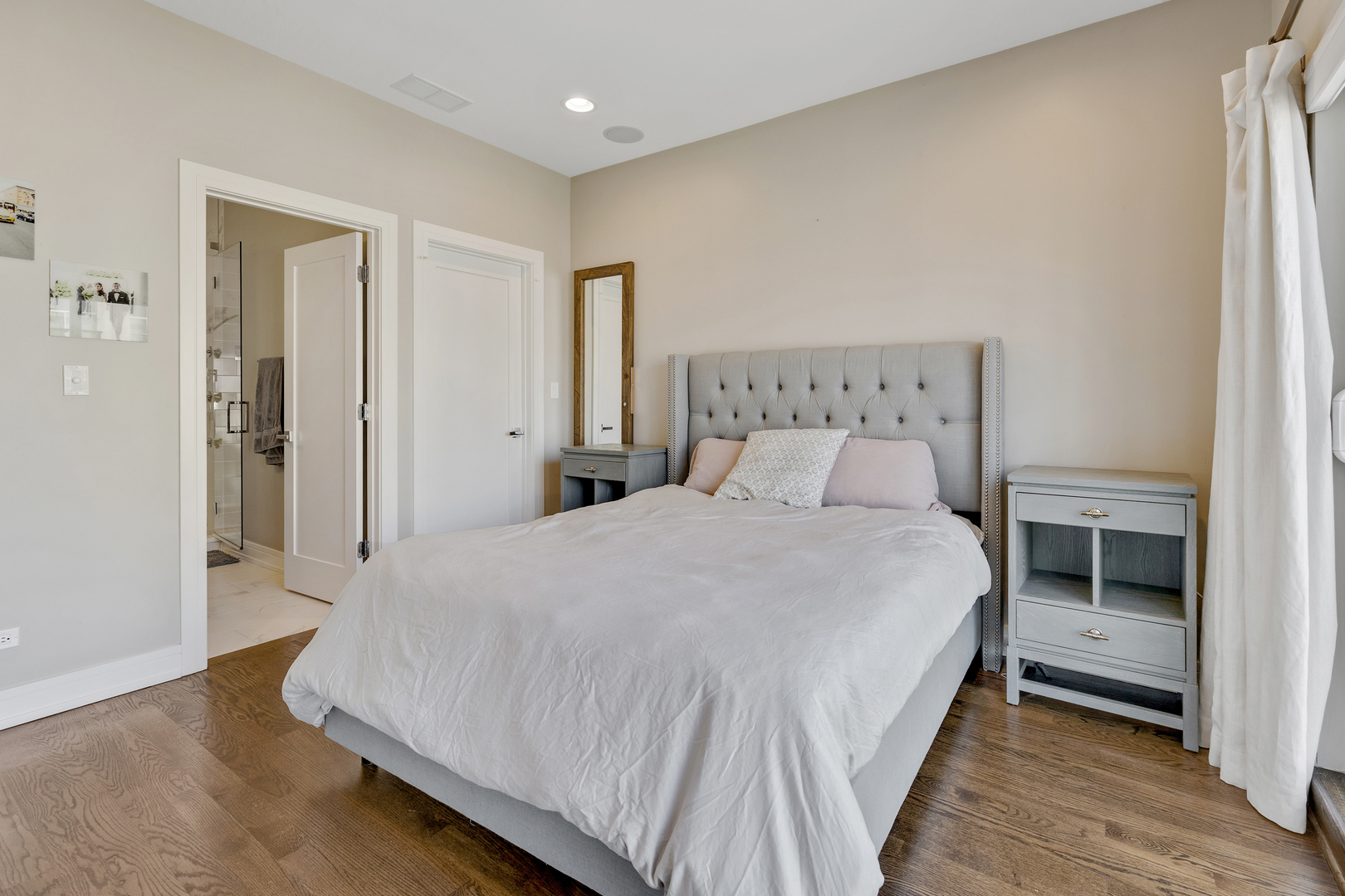1820 West Haddon Avenue, Unit 2 Chicago, IL 60622 - Photo 14 of 18 a bedroom with a bed and a table