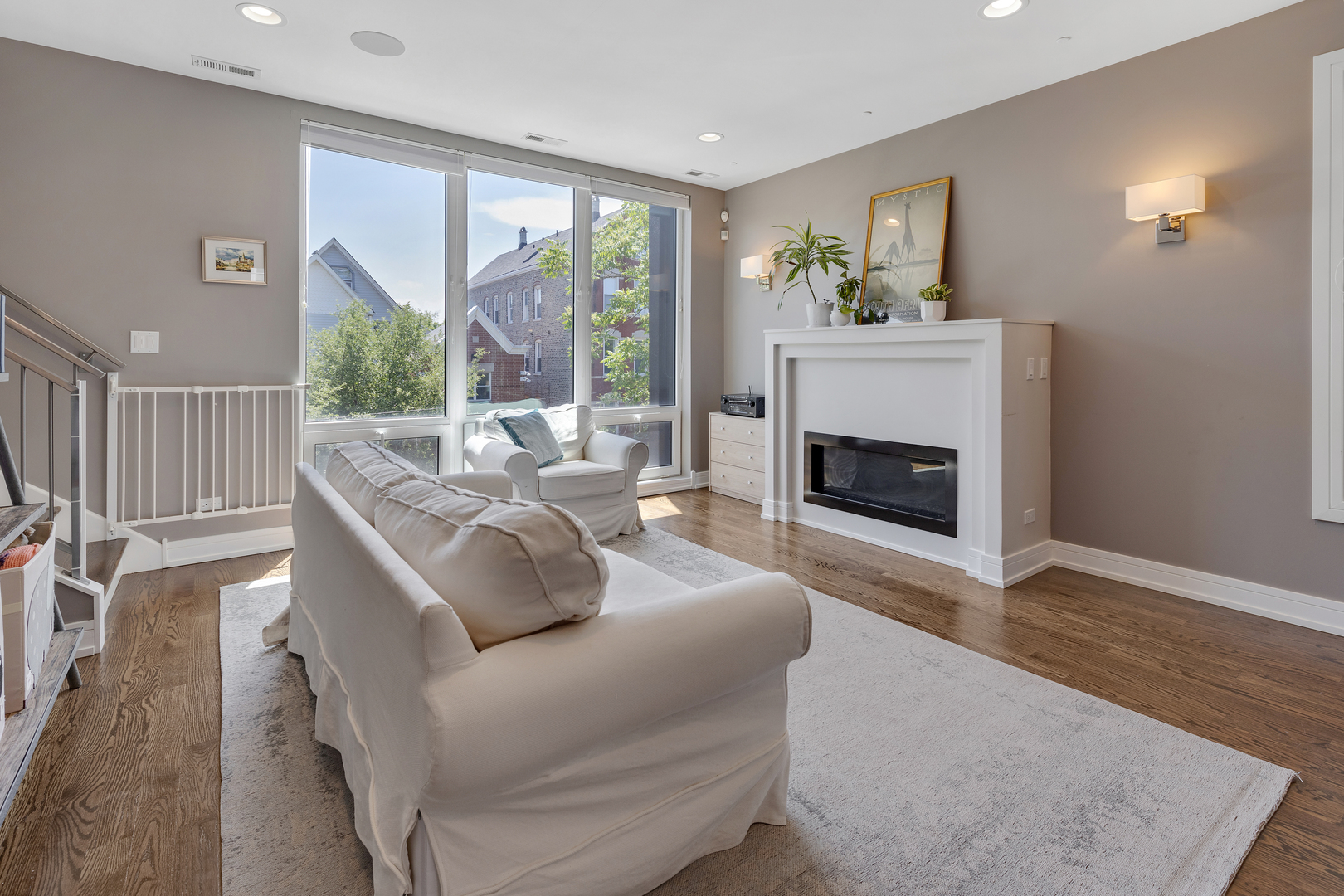 1820 West Haddon Avenue, Unit 2 Chicago, IL 60622 - Photo 2 of 18 a living room with furniture large window and a fireplace