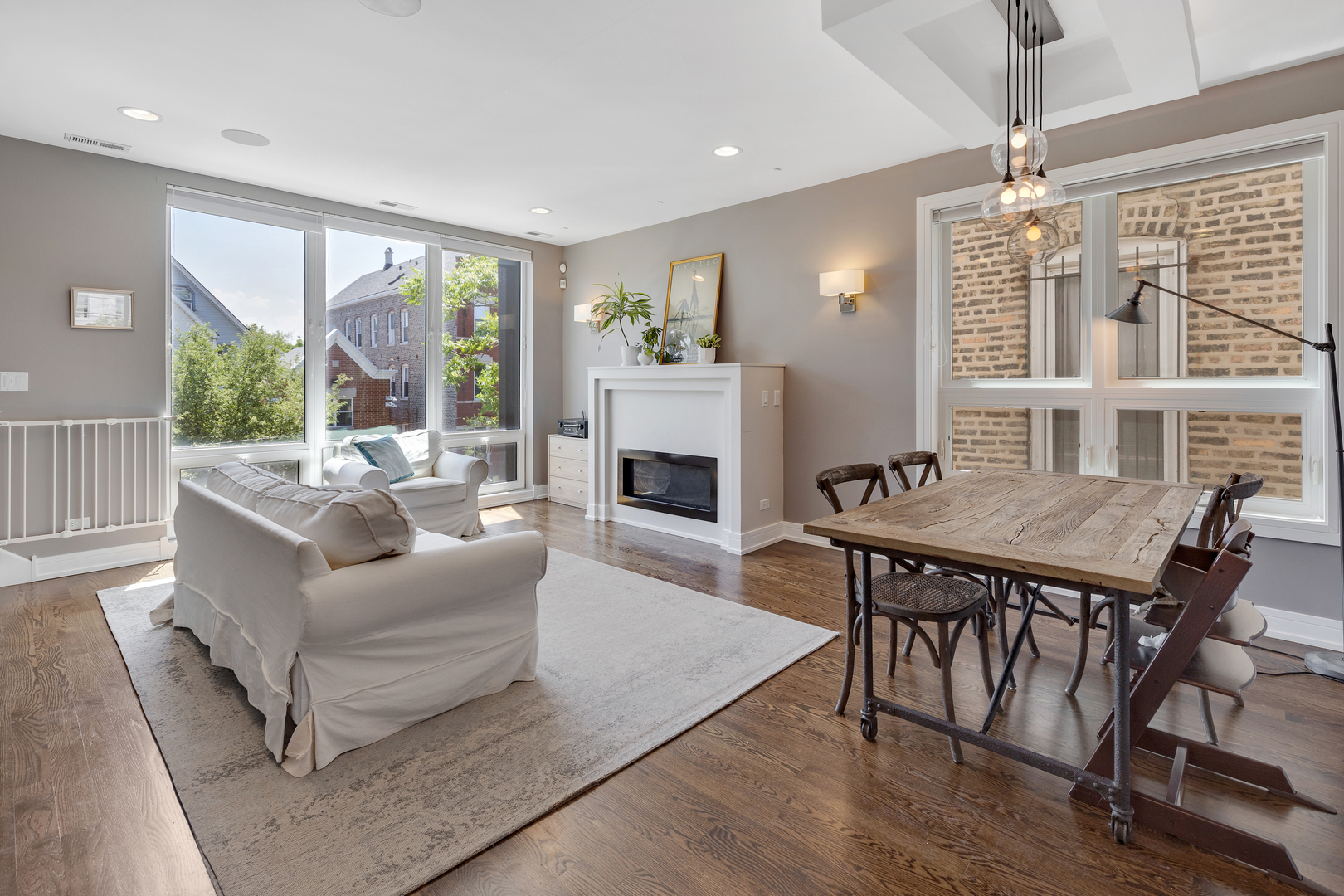 1820 West Haddon Avenue, Unit 2 Chicago, IL 60622 - Photo 3 of 18 a living room with furniture a table and a fireplace