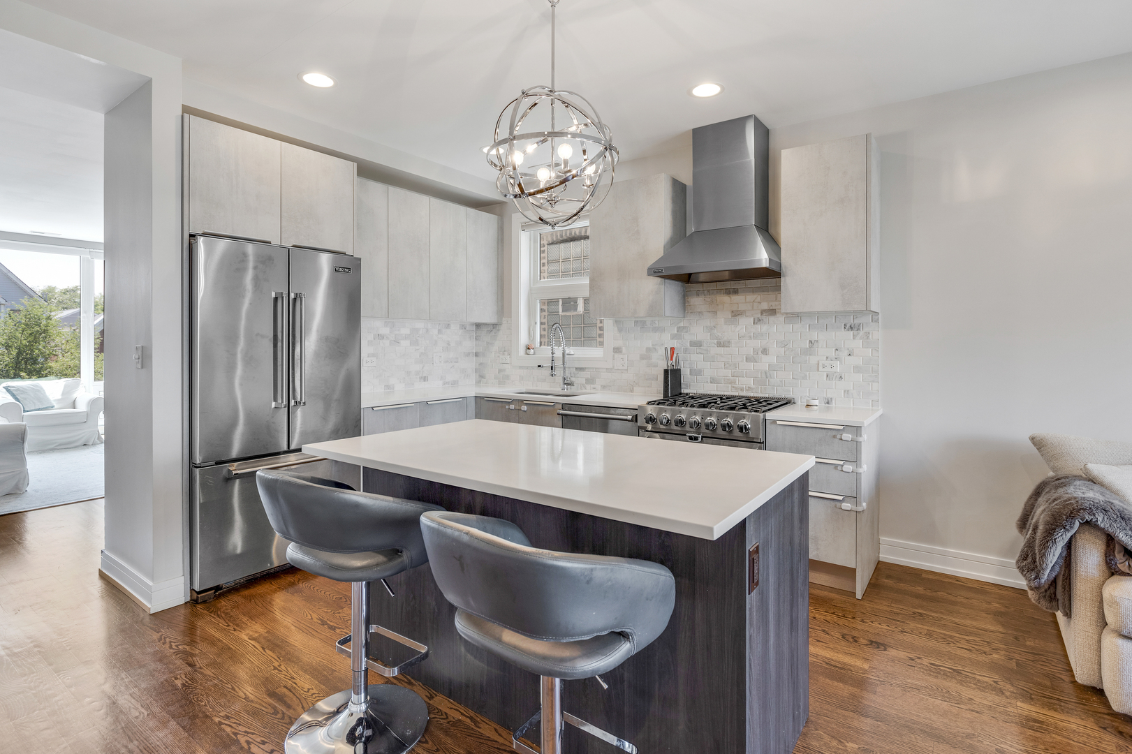 1820 West Haddon Avenue, Unit 2 Chicago, IL 60622 - Photo 7 of 18 a kitchen with stainless steel appliances granite countertop a sink a stove a refrigerator and island