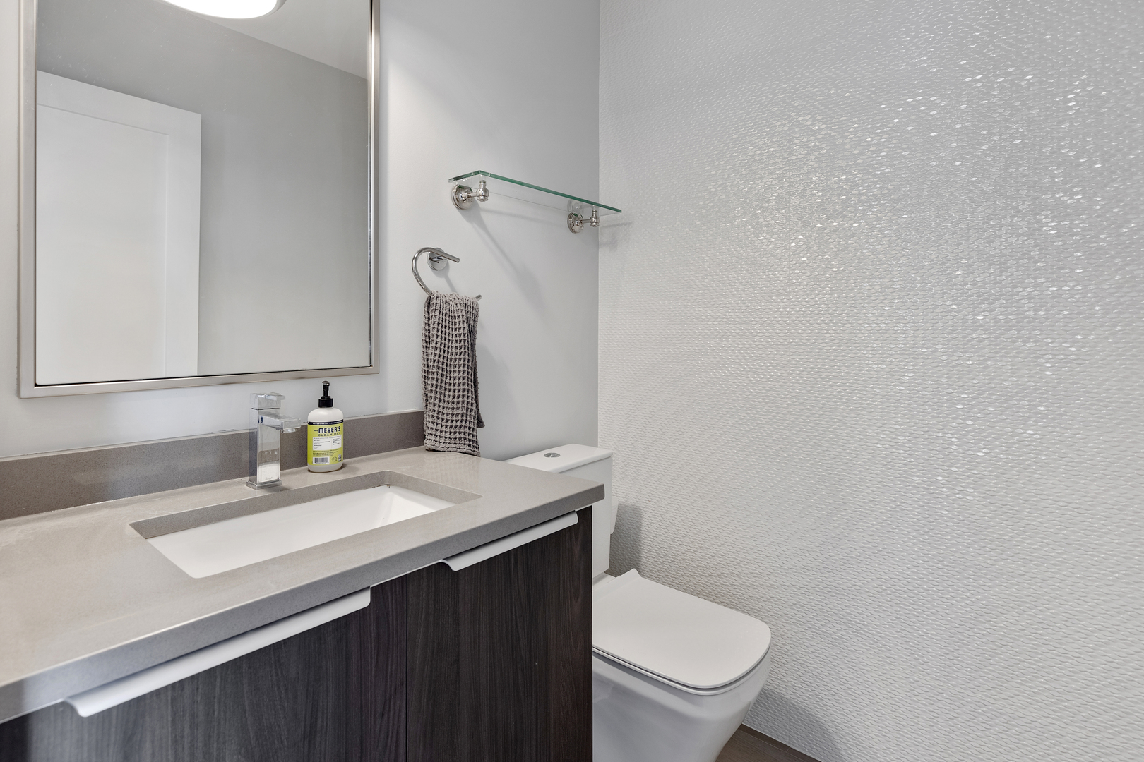 1820 West Haddon Avenue, Unit 2 Chicago, IL 60622 - Photo 8 of 18 a bathroom with a granite countertop toilet sink and mirror