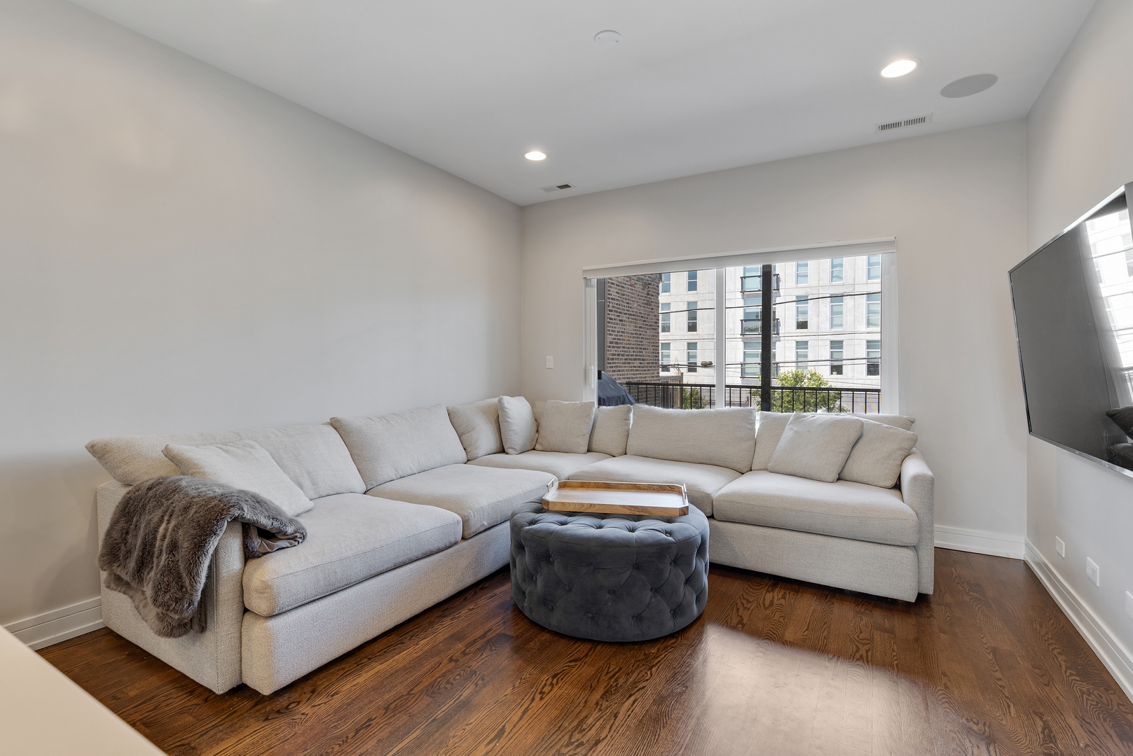 1820 West Haddon Avenue, Unit 2 Chicago, IL 60622 - Photo 9 of 18 a living room with furniture and a flat screen tv