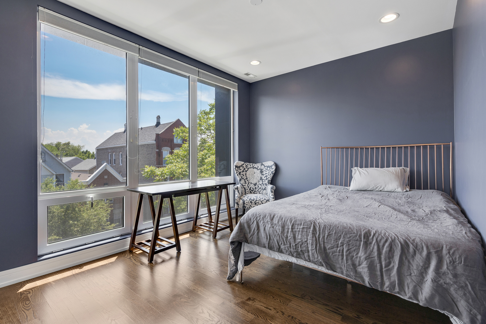 1820 West Haddon Avenue, Unit 2 Chicago, IL 60622 - Photo 10 of 18 a bedroom with a bed and a table