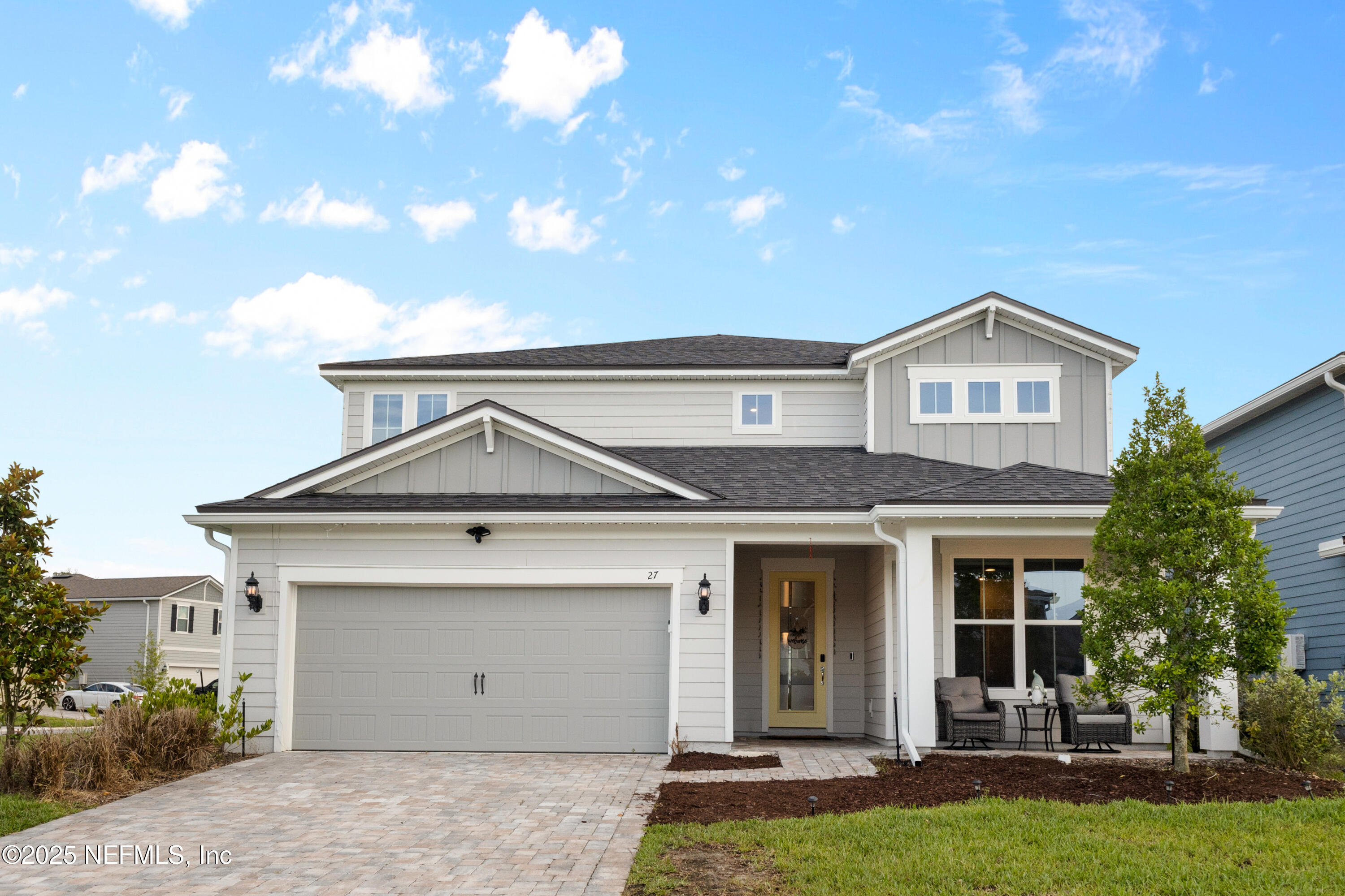 a view of a house with a yard and plants