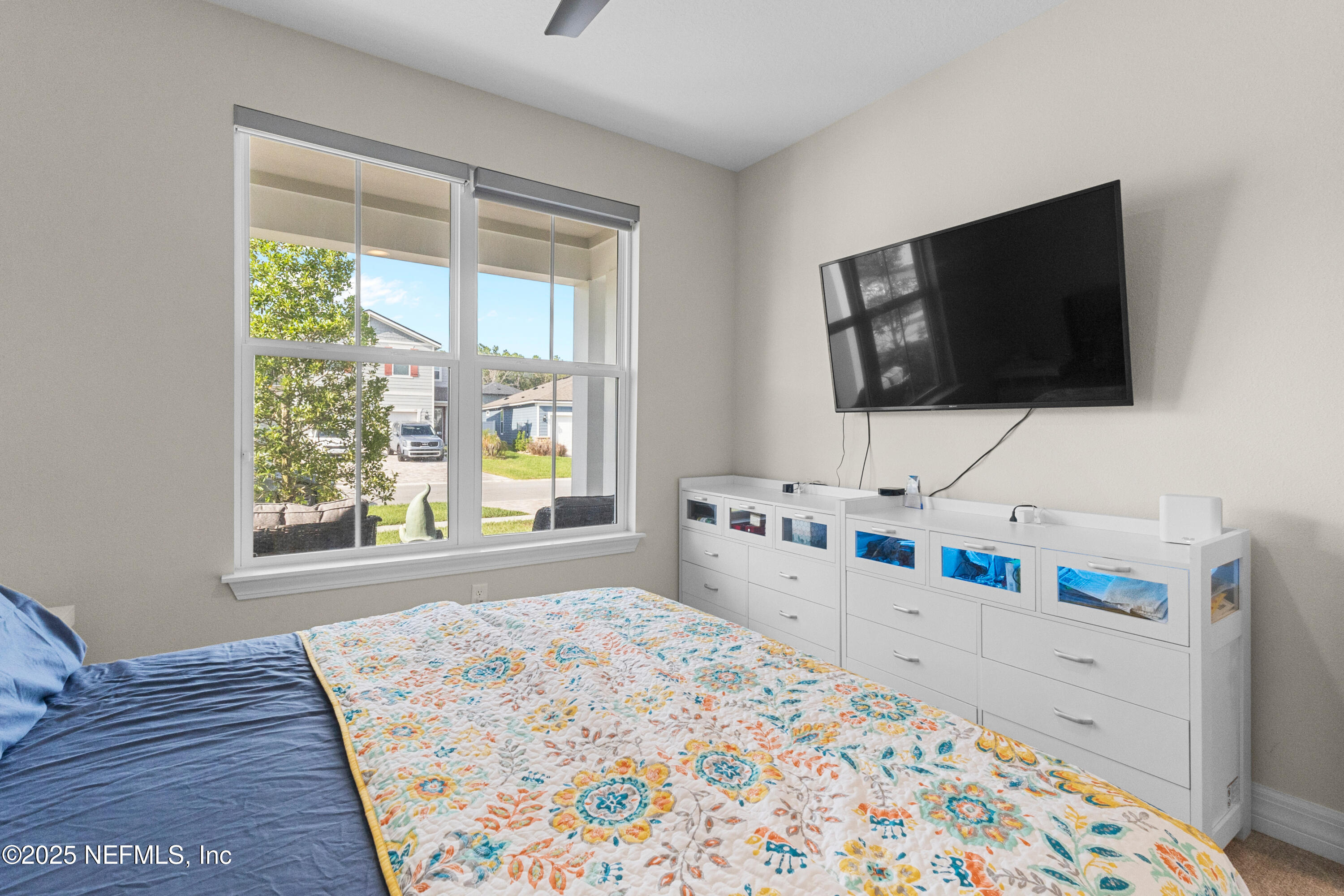 27 Flintlock Ln Street St. Augustine, FL 32095 - Photo 11 of 65 a bedroom with a bed and a flat screen tv