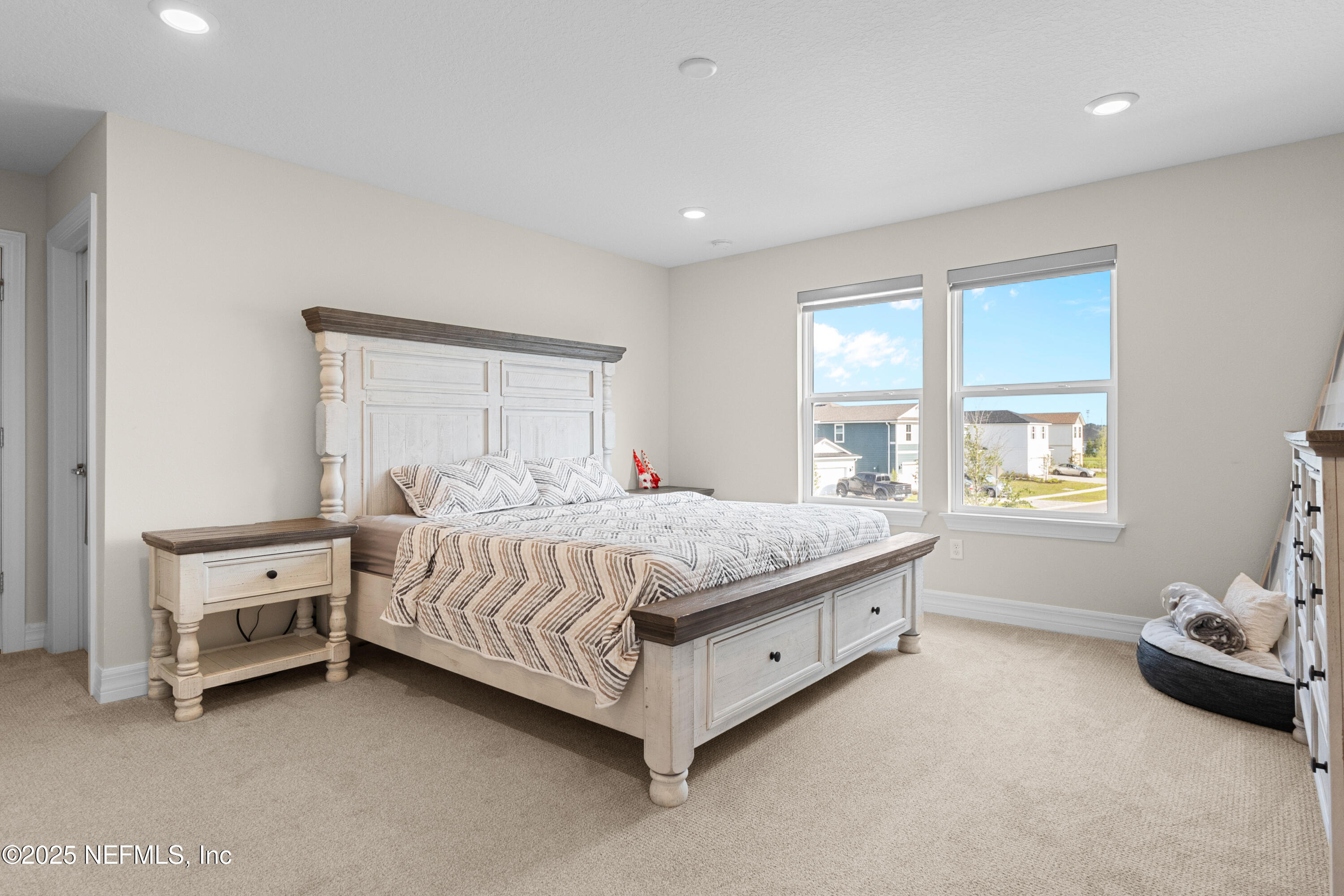 27 Flintlock Ln Street St. Augustine, FL 32095 - Photo 15 of 65 a bedroom with a bed and a window