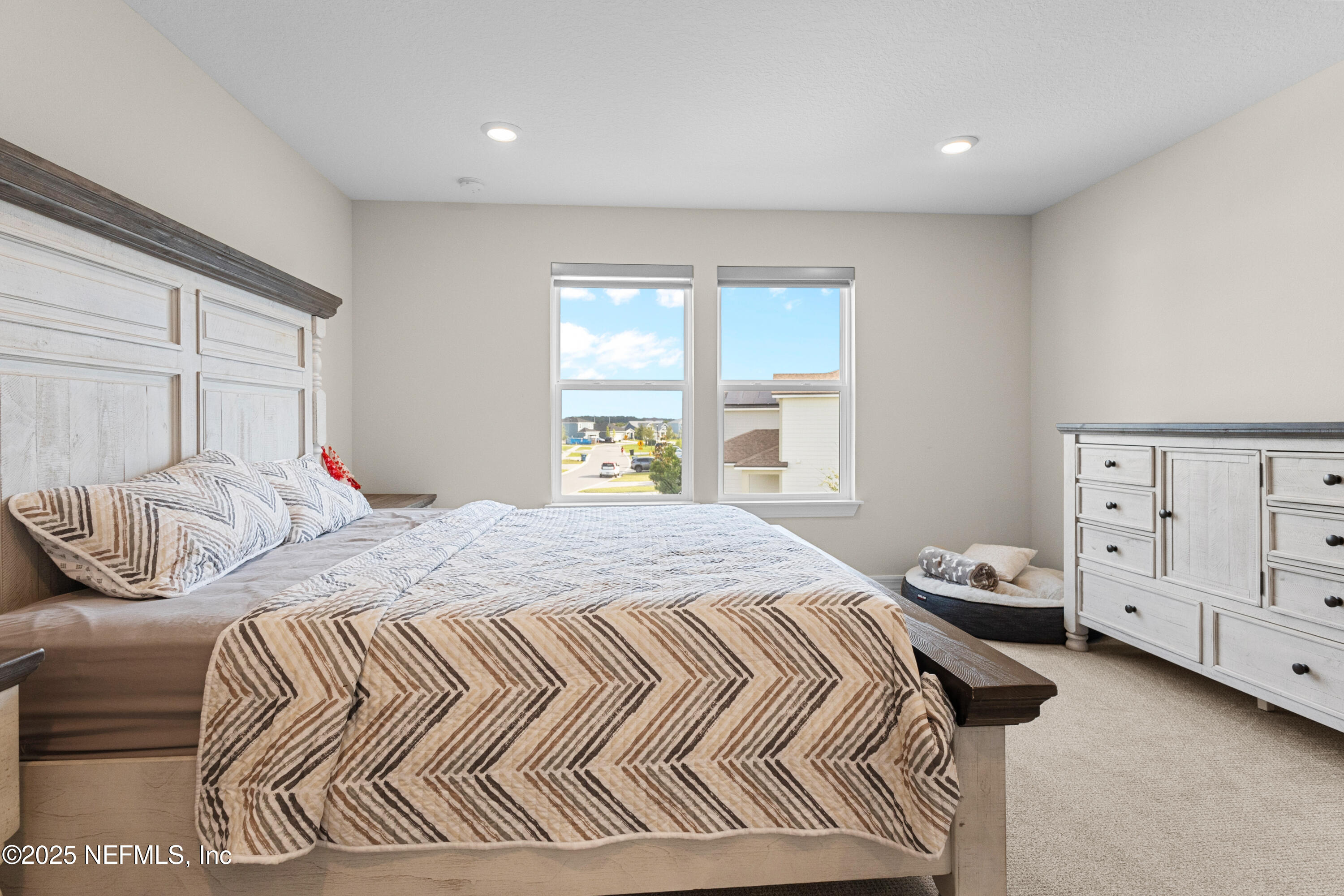 27 Flintlock Ln Street St. Augustine, FL 32095 - Photo 16 of 65 a bedroom with a bed and a window