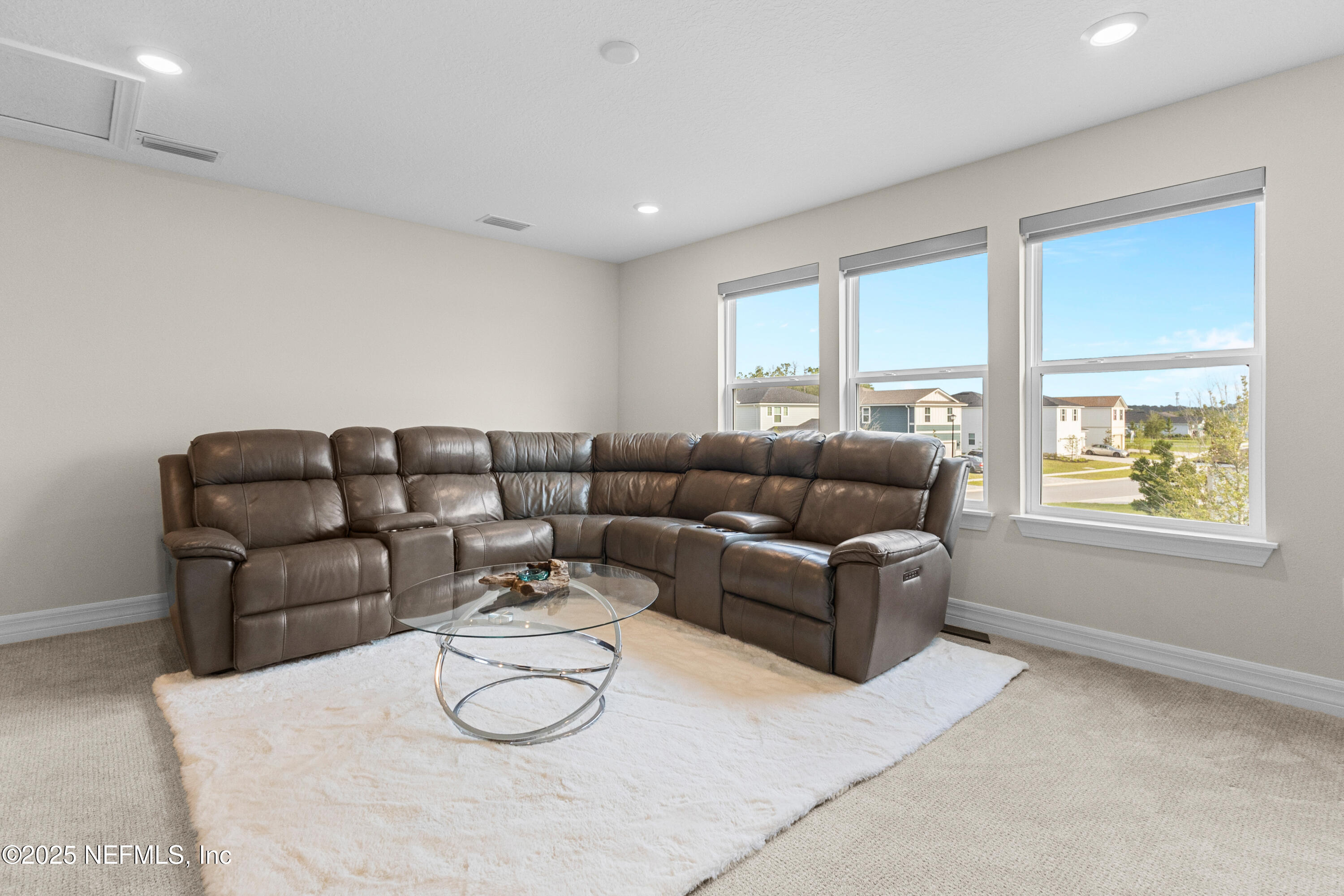 27 Flintlock Ln Street St. Augustine, FL 32095 - Photo 18 of 65 a living room with furniture and a large window