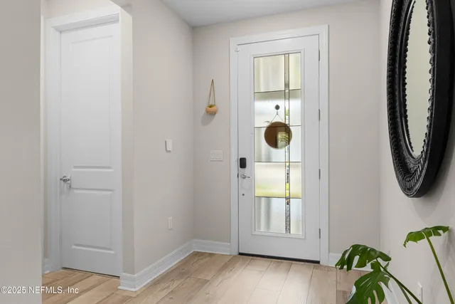 a living room with furniture a window and a flat screen tv