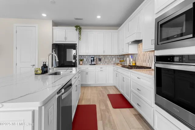 a view of house with garden and tall windows