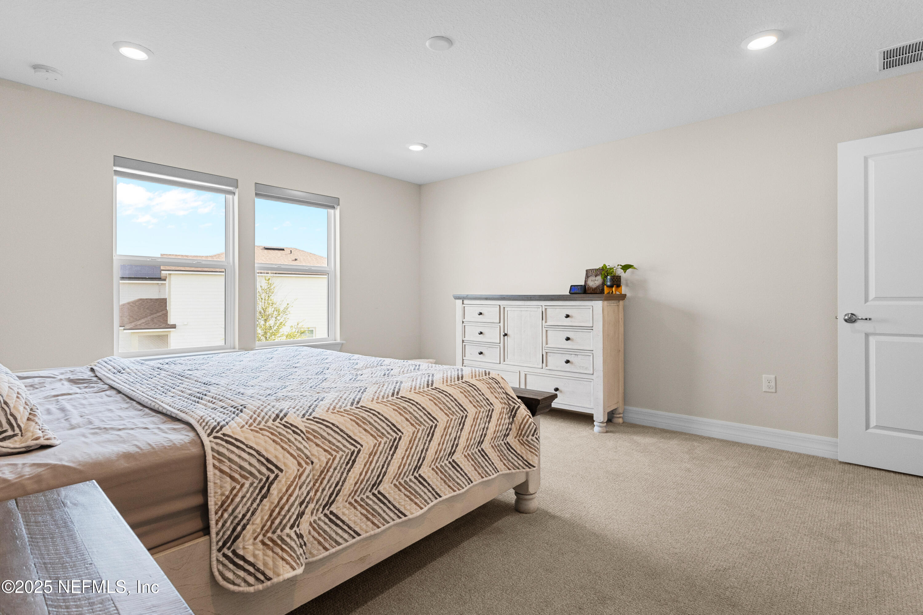 27 Flintlock Ln Street St. Augustine, FL 32095 - Photo 25 of 65 a bedroom with a bed and a window