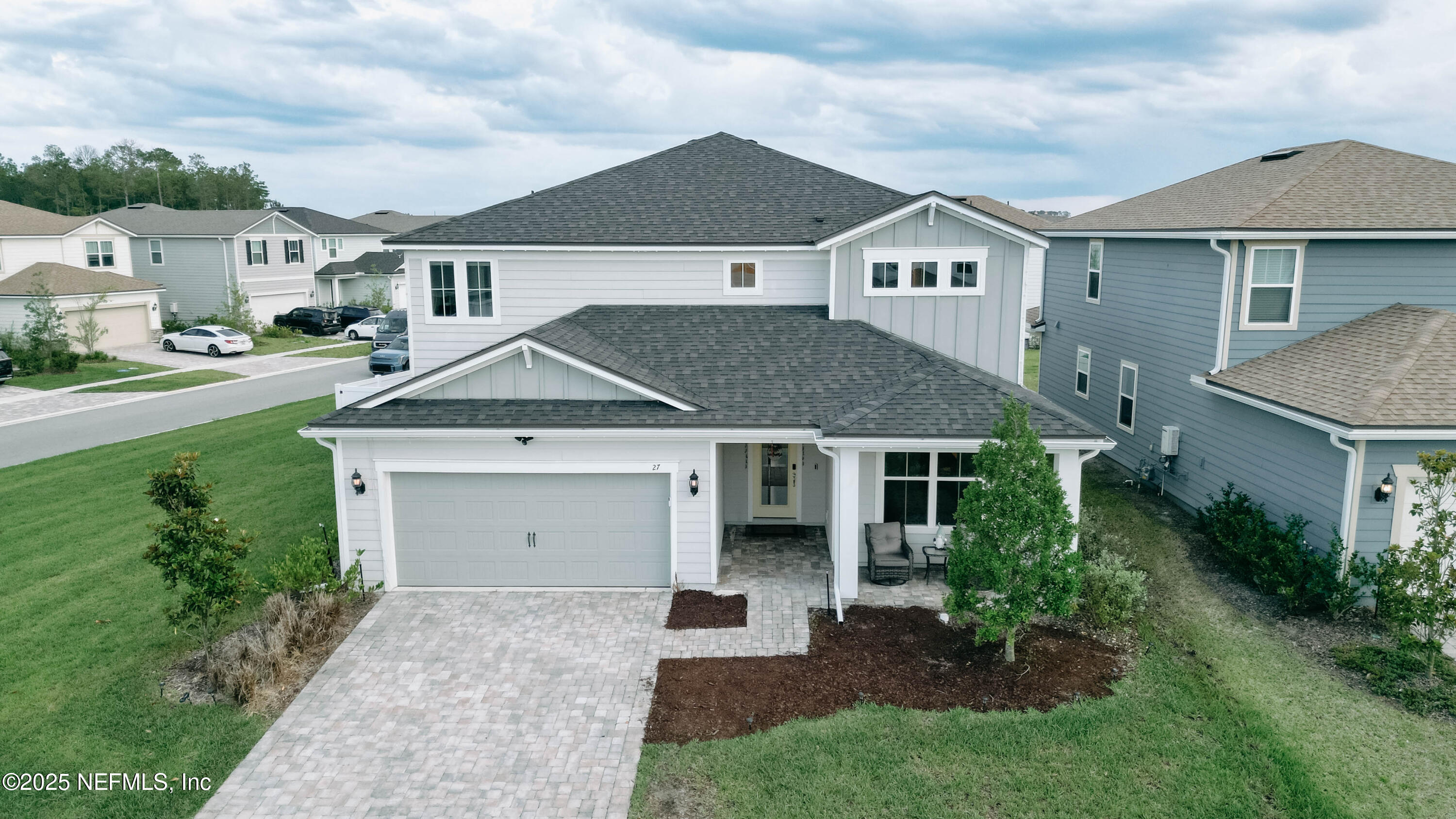 27 Flintlock Ln Street St. Augustine, FL 32095 - Photo 29 of 65 a view of house with garden and tall windows