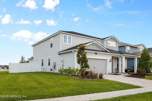 a bathroom with double sink and a mirror