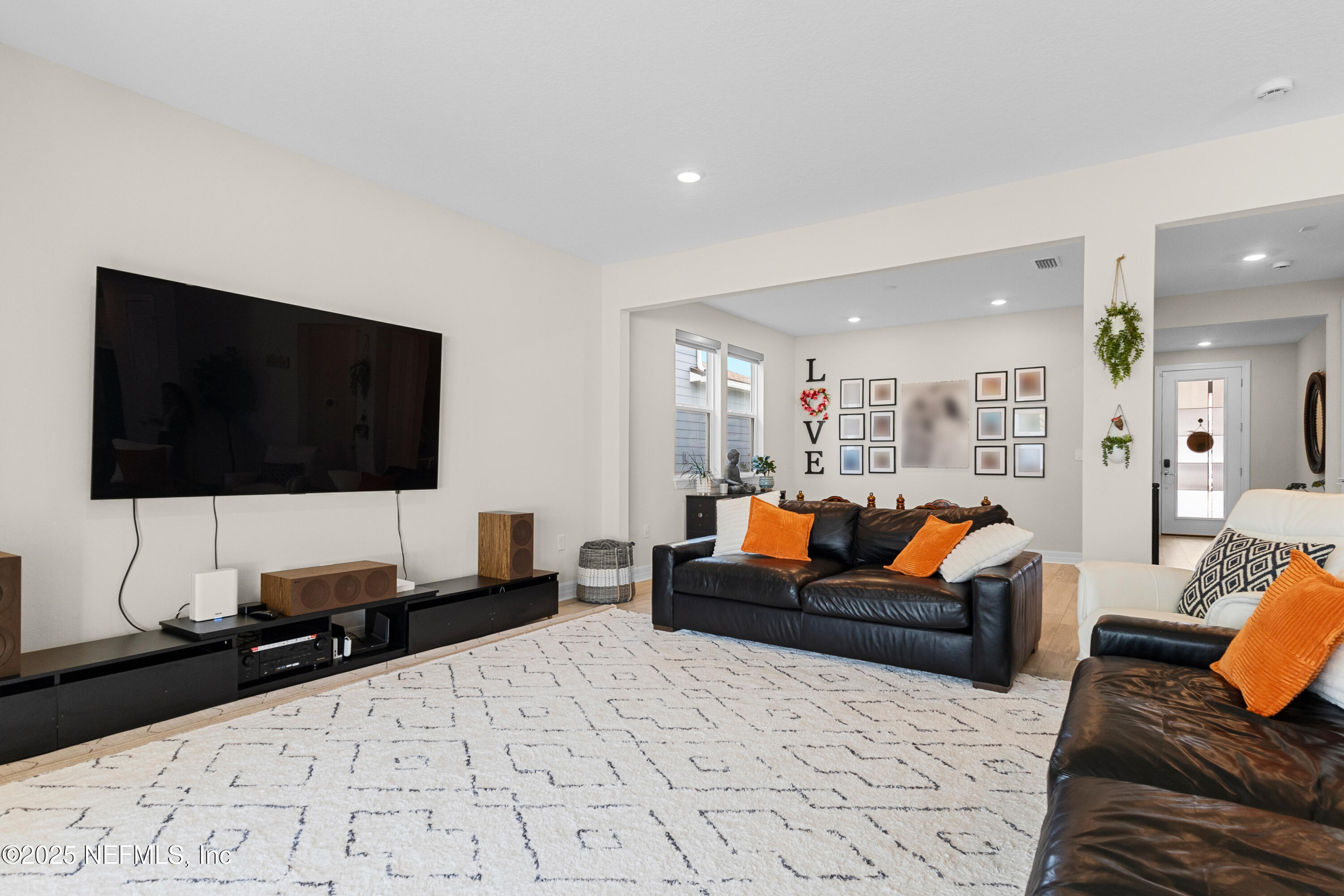 27 Flintlock Ln Street St. Augustine, FL 32095 - Photo 37 of 65 a living room with furniture and a flat screen tv