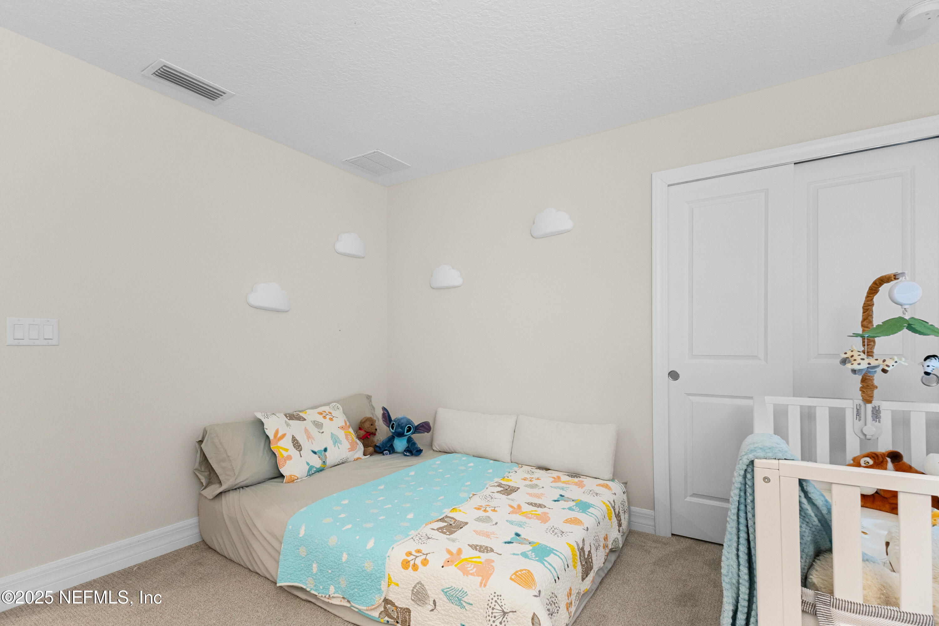 27 Flintlock Ln Street St. Augustine, FL 32095 - Photo 39 of 65 a bedroom with a bed and a table in it