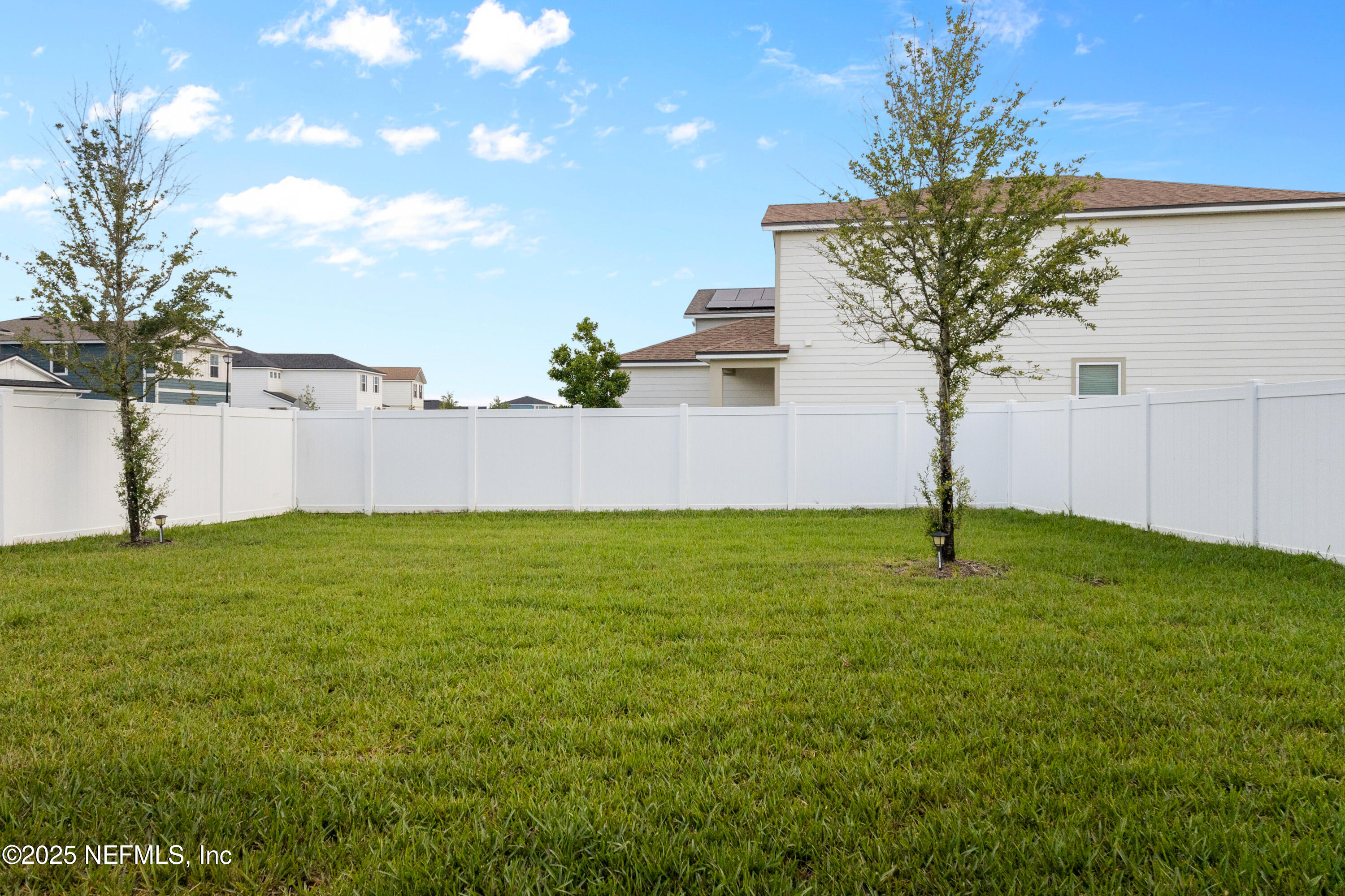 27 Flintlock Ln Street St. Augustine, FL 32095 - Photo 40 of 65 a view of a yard with a house