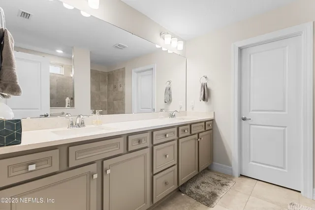 a bathroom with a sink toilet and mirror
