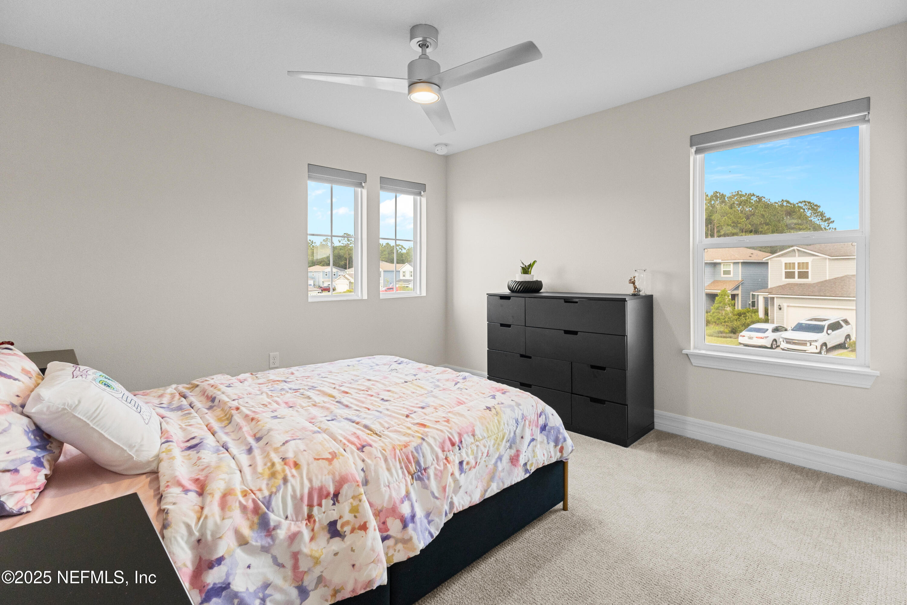 27 Flintlock Ln Street St. Augustine, FL 32095 - Photo 49 of 65 a bedroom with a bed and a window